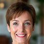 Sarah K. Austin, TX, smiling in a testimonial photo.