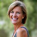 A confident, smiling woman in her 40s, embodying health and vitality after weight loss.